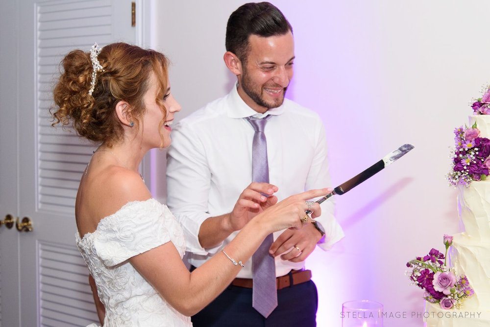 Bride and groom cutting the cake at Lauderdale Yacht Club.