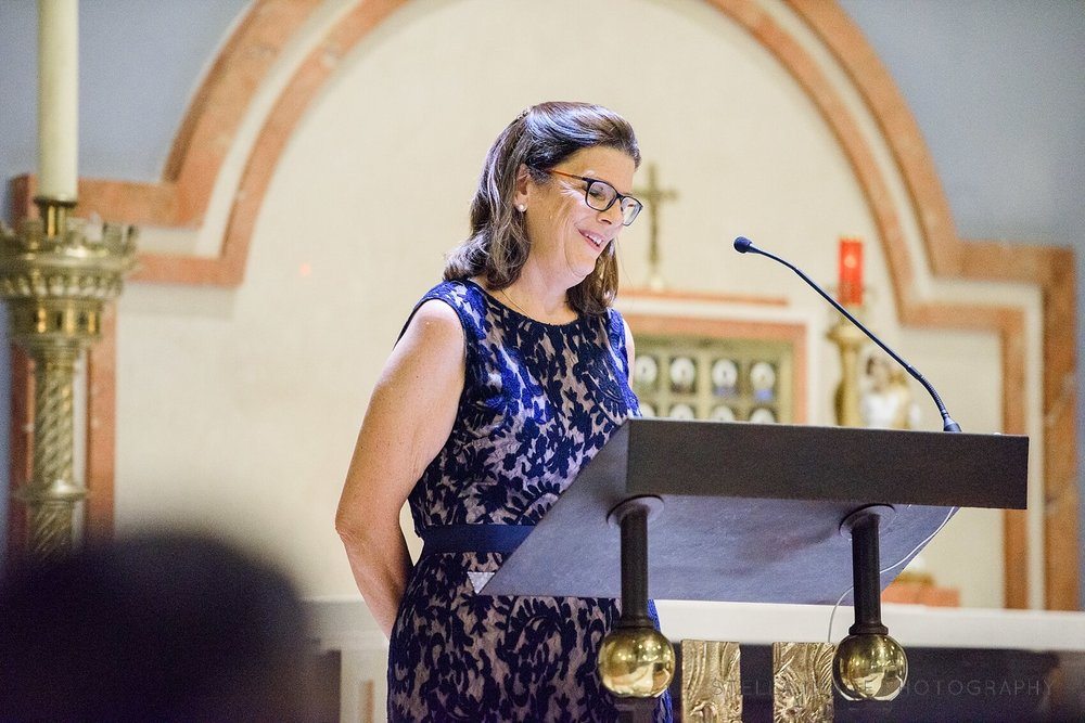 Mother of the Groom recites during ceremony. 