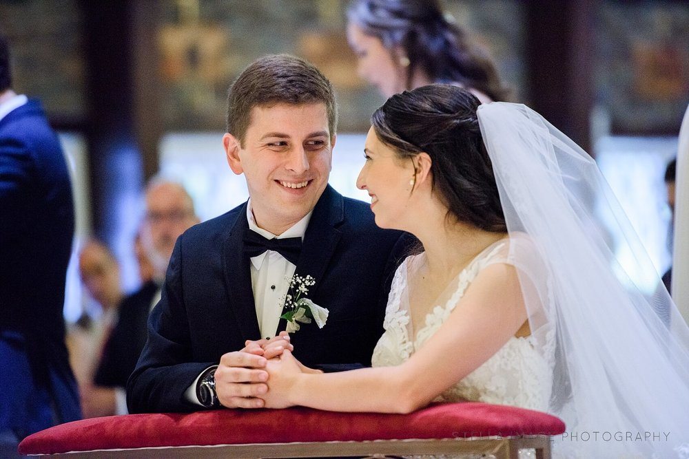 Bride and Groom share a smile during ceremony.